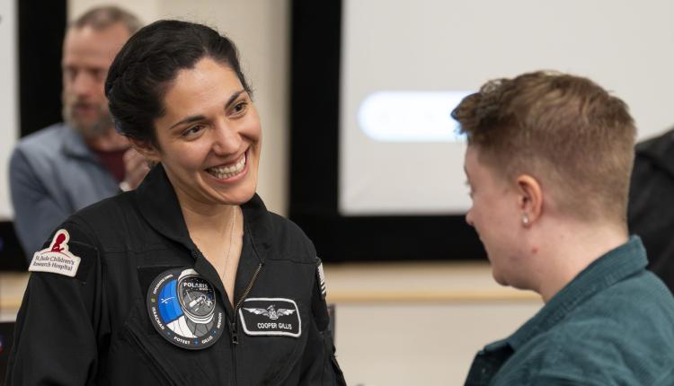 Alumna Sarah Gillis speaks to CU Boulder aerospace students about her experience as an astronaut.
