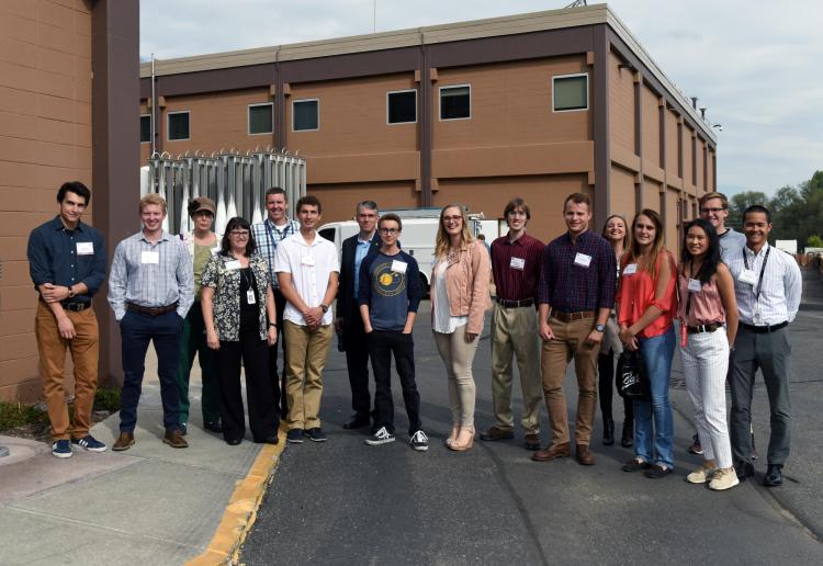 A group of students at the Fisher Manufacturing Center, Boulder, Colorado. Erik Stolz is center left, in white shirt.