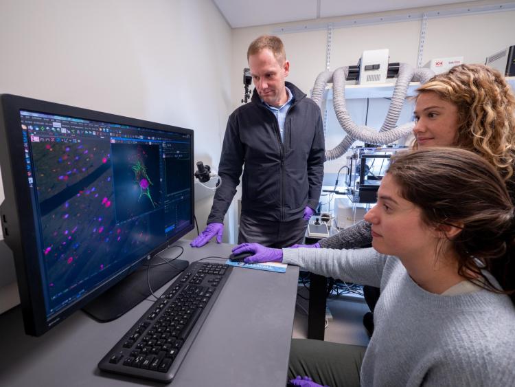 Corey in the lab with students