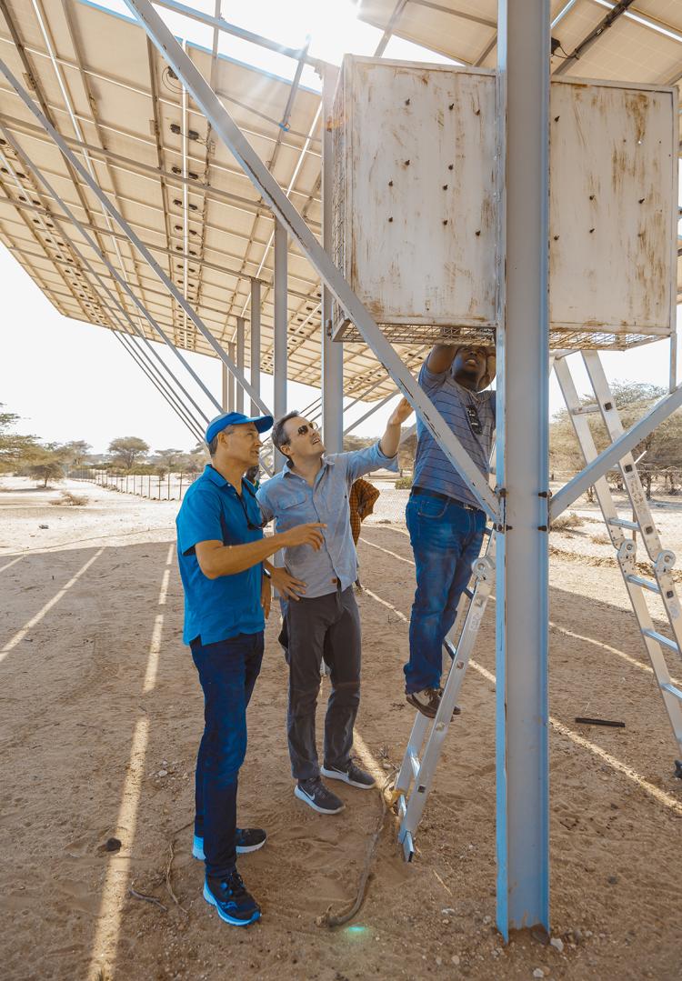 Evan Thomas looking at infrastructure in the field