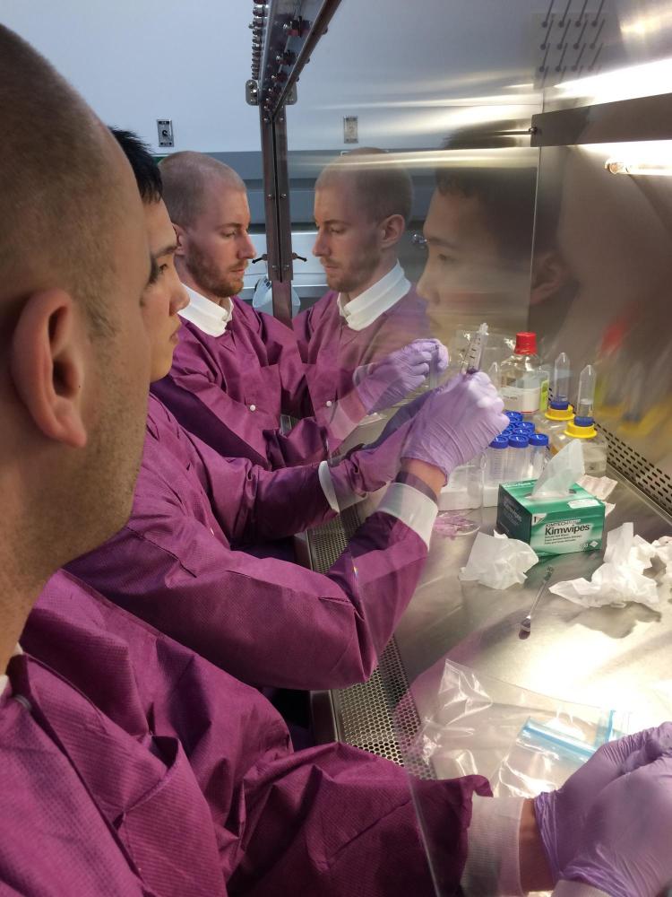 Scientists and engineers working together during the final preparation of the flight samples. From left to right: Sam Piper (CU), Kevin Ngo (KU), Eric Yarns (KU).