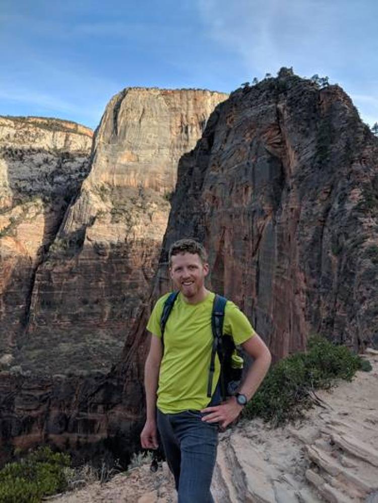 Andrew Kramer outside in a canyon