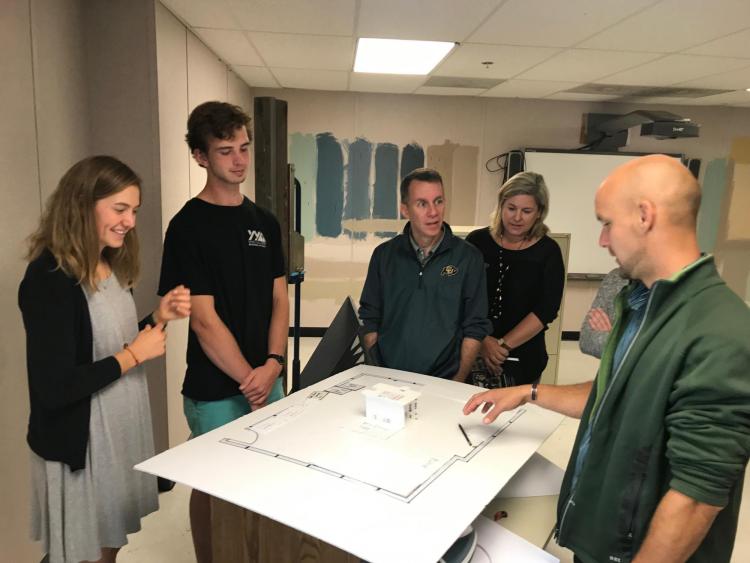 Bobby and Karen Braun tour Animas High School's Maker Space with students and an engineering instructor.