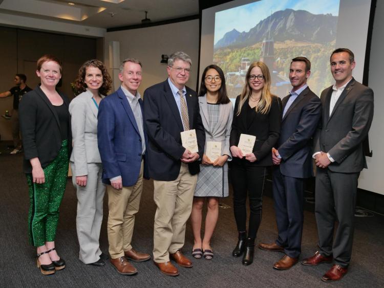 The three Global Engineering Award winners pose with Mortenson Center staff and the college's dean, Bobby Braun.