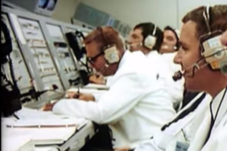 Woodward, center, leaning over the LH2 Panel writing fuel loading times.