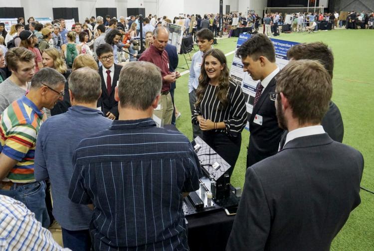 Students demonstrate their project for visitors at the Expo.
