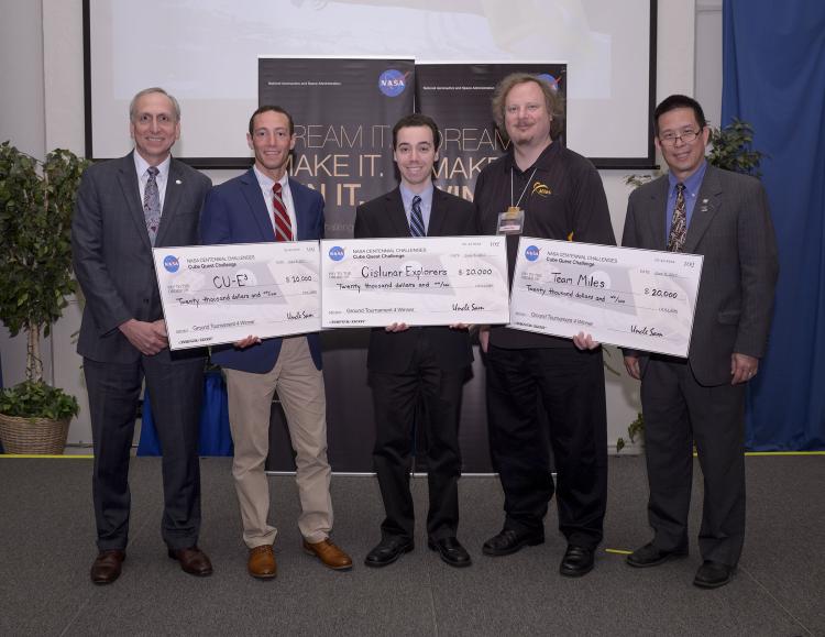 The check presentation to the three winning teams