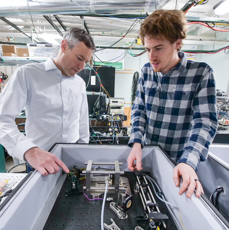 Quantum Engineering Initiative lead Greg Rieker with a student in Rieker's lab.