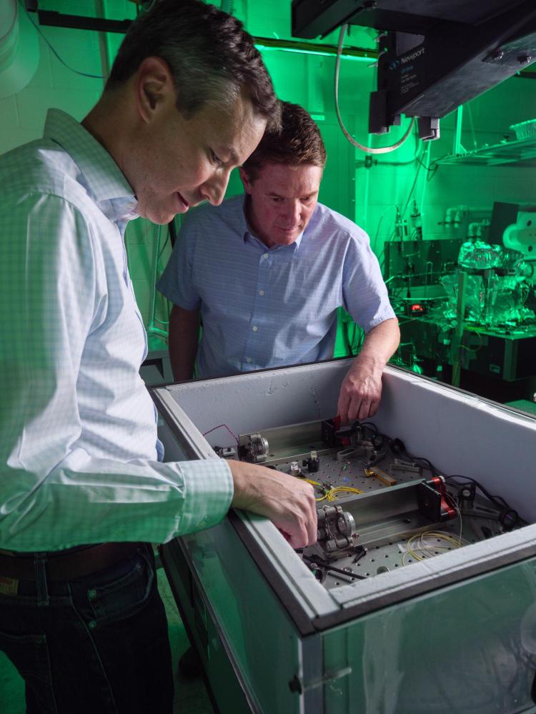 Scott Diddams and Greg Rieker in the lab