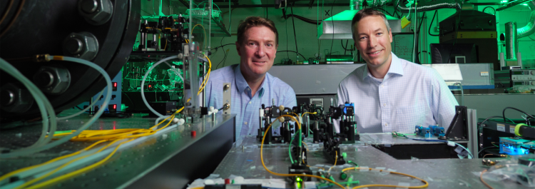 Quantum Engineering Initiative lead Greg Rieker, right, with Scott Diddams in the lab.