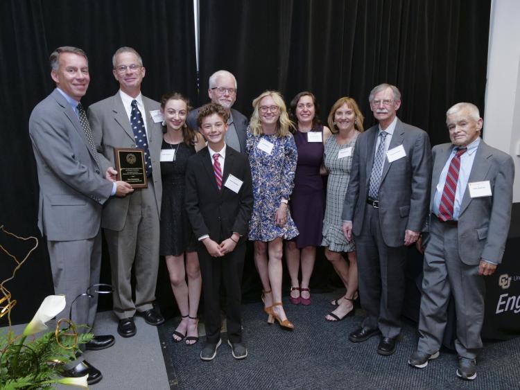 Lisa Hardaway's family accepts her Engineer of Distinction Award during the Engineering Alumni Awards Banquet.
