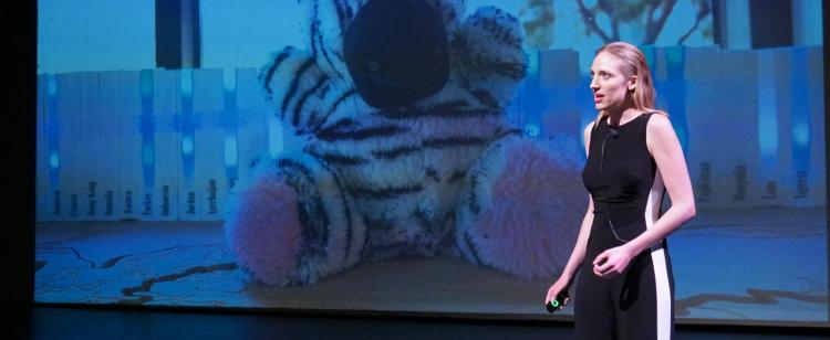 A student participant pitches her venture at Catalyze demo day