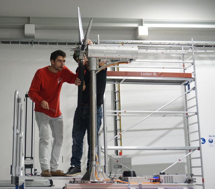 Misha and another researcher working on the turbine