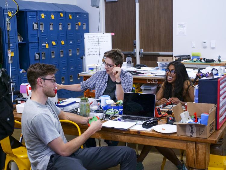Students in Catalyze 2019 work together at table