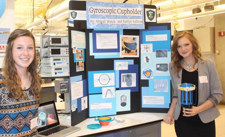 Students with gyroscopic cup holder project