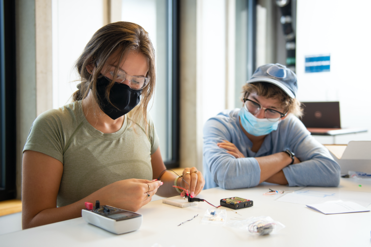 Two students working in the ITLP lab on Arduino microcontrollers