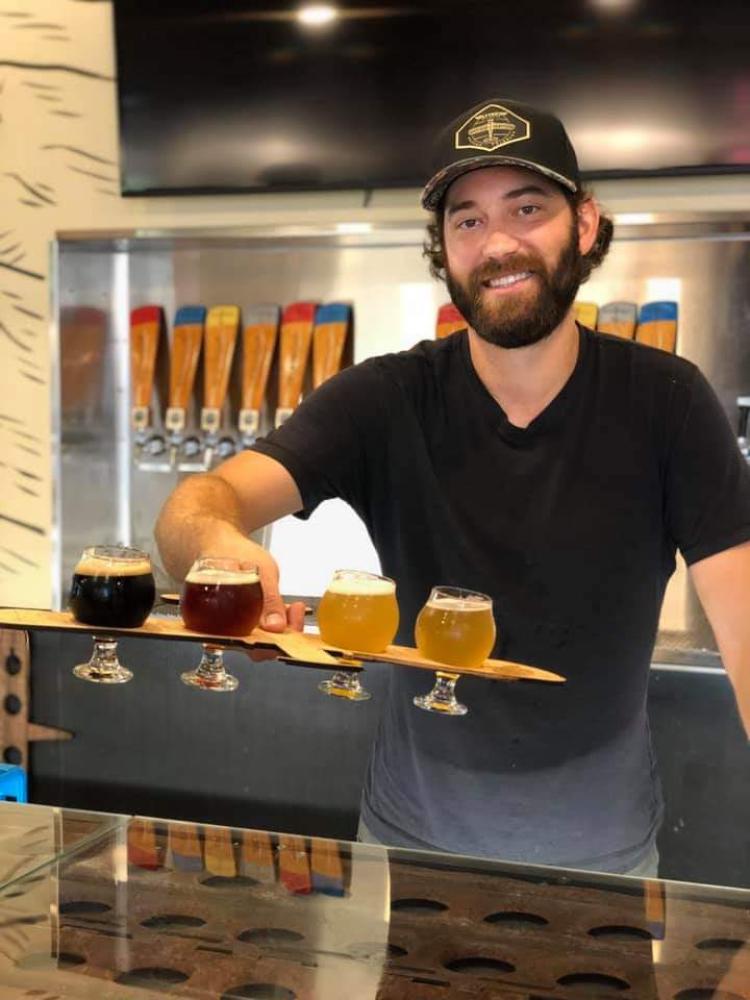 Jason Slingsby serves beer at FlyteCo