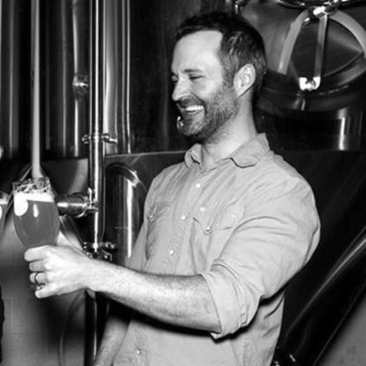 Jason zumBrunnen pouring beer from barrel