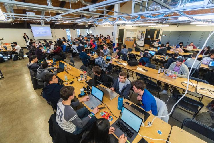Students work on projects in the Idea Forge during Local Hack Day.