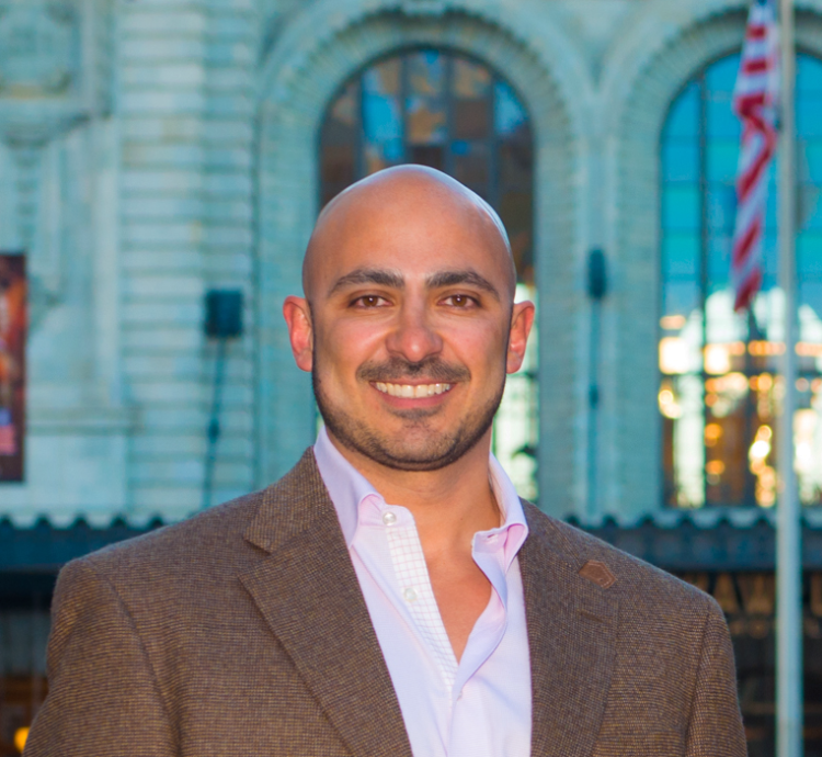 Marco Campos in a brown blazer
