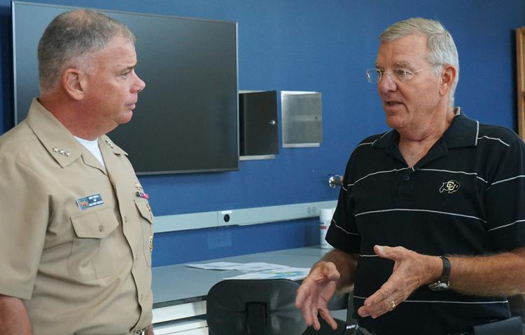 Admiral Nowell and professor Voss speaking to each other during the visit.