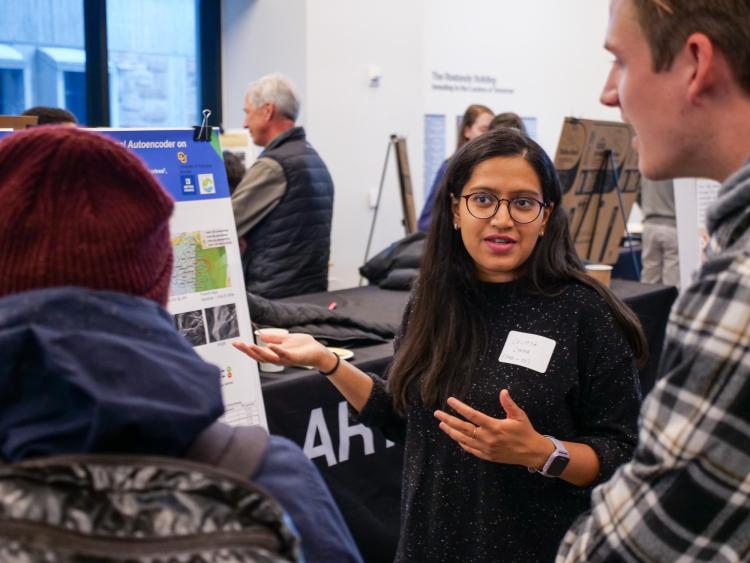 Computer Science PhD candidate Saumya Sinha presents a poster at the Research and Innovation for Climate Change Open House on Nov. 30 at CU Boulder.