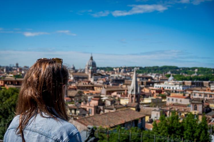 Woman looks over Rome city view