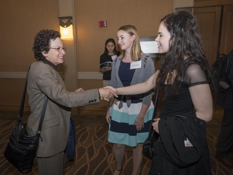 Jill Tietjen (left) meets scholarship recipients at the college's 2017 scholarship dinner.