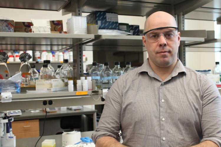 Tim Whitehead in his laboratory with equipment in the background