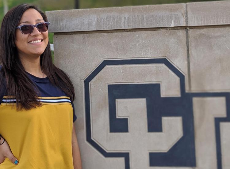 Gabriela Tolosa Ramirez by a CU Boulder sign