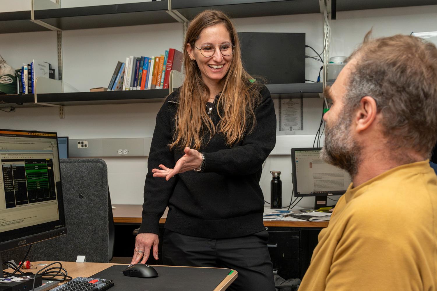 Tamara Lehman in her lab talking with a student