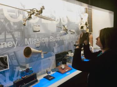 Kelly Winn takes a photo during the Lockheed Martin tour.