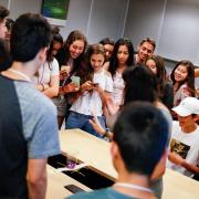 Students crowd around a bridge to wait for judging results