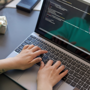 Woman editing code on a laptop