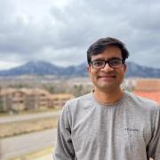 Kaustav Bera with the mountains blurred in the background