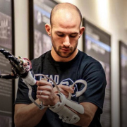 Jacob Segil with prosthetic in a hallway.