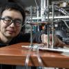 Assistant Professor Longji Cui next to his novel TPV device