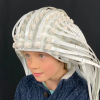 Child wearing OPM sensor helmet manufactured by FieldLine Inc.