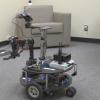 A wheeled robot with arms.