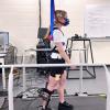 A series of tests, using the powered exoskeleton, motion capture cameras and integrated treadmills, being performed inside of the Welker Lab space.
