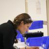 Woman doing some testing on laptop in a lab