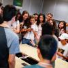 Students crowd around a bridge to wait for judging results