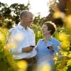 Kevin Green and wife Clodagh drinking wine in a vineyard