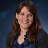 Abbie Liel portrait on blue background 