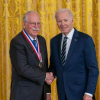 Hull shakes hands with Biden after receiving his medal