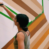 A woman painting a wall