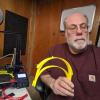 Staff member holds 3D printed face shield components