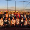 Dave Clough with members of the AIUS women's basketball team