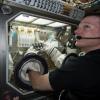NASA astronaut Terry Virts manipulating a BioServe experiment on ISS