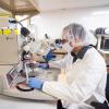 A researcher works in a clean room in CU Boulder's COSINC facility, which will support a new $20 million quantum facility on campus.